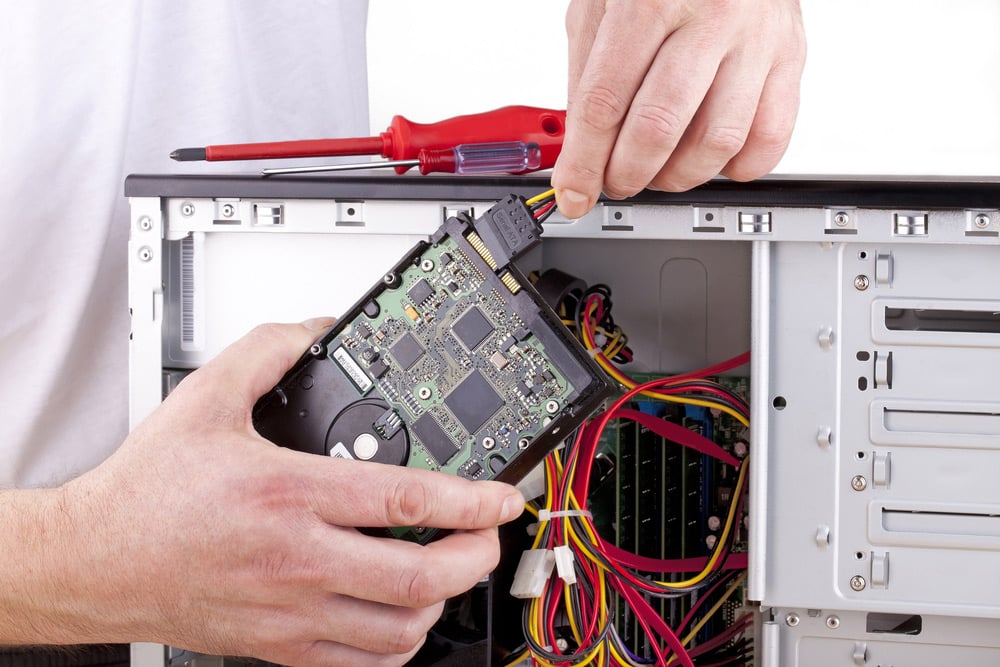 A Man Is Troubleshooting A Computer