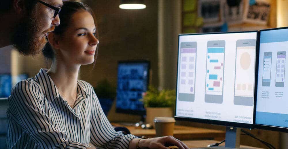 Man and Woman in Front of Computer